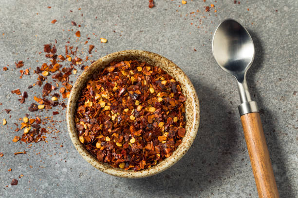 Organic Raw Red Pepper Flakes stock photo