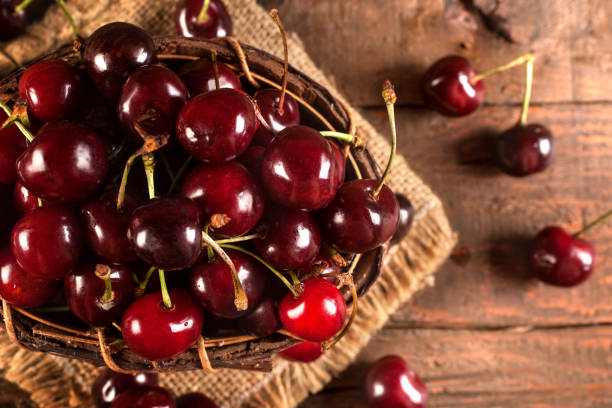 Organic red cherries in the basket stock photo