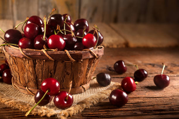 Organic red cherries in the basket stock photo
