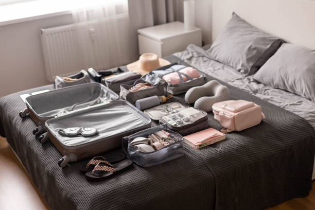 Organization of storage carrying necessary things in comfortable case with konmari method on bed stock photo