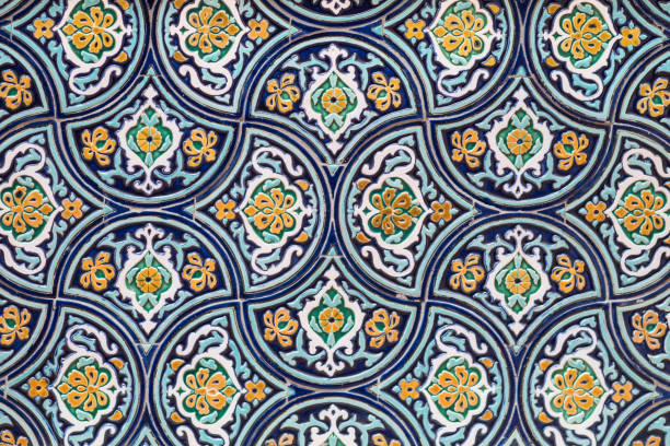 Oriental ornaments on a wall A closeup of oriental ornaments with blue, white and yellow on a wall central asia stock pictures, royalty-free photos & images
