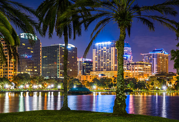 Orlando Florida, skyline, Lake Eola, cityscape, skyscrapers, reflections, water, night stock photo