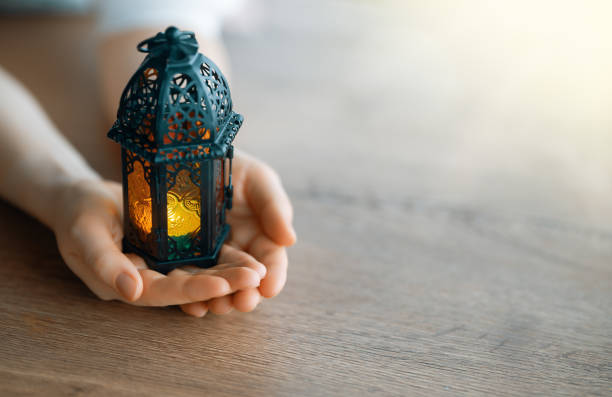 Ornamental Arabic lantern with burning candle stock photo