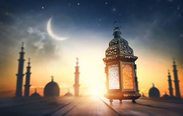 Ornamental Arabic lantern with burning candle stock photo