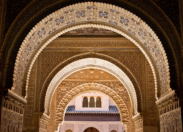 Ornate decoration at Albambra Palace in Granada, Spain Detail of ornate decoration at Alhambra Palace in Granada, Spain. This photograph was taken at the entrance to Patio de los Leones (Court Of The Lions). granada spain stock pictures, royalty-free photos & images