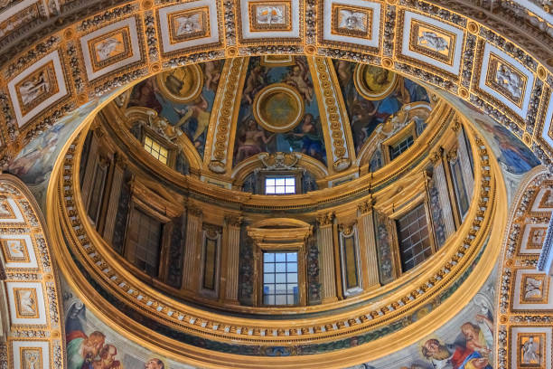Ornate interior and a dome of Saint Peter's Basilica in Vatican stock photo