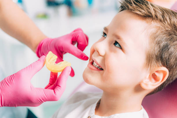 Orthodontist working with little boy Orthodontist working with little boy orthodontist stock pictures, royalty-free photos & images