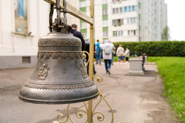 Orthodox bell suspended on a metal beam, close-up stock photo