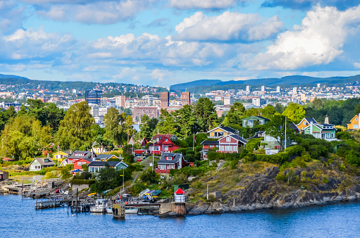 View of Oslo between city and typical nordic cottage