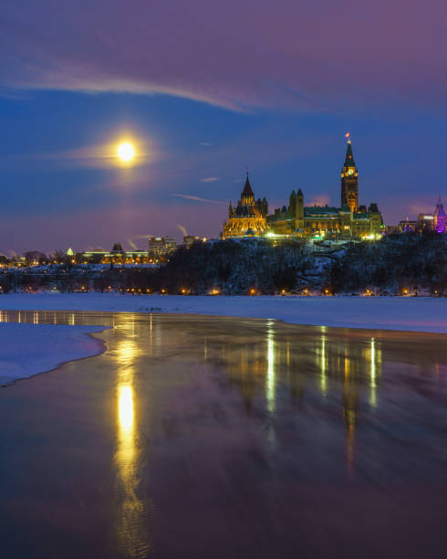 Ottawa skyline in winter under full moon stock photo