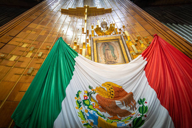 Our Lady of Guadalupe with mexican flag in Mexico City stock photo