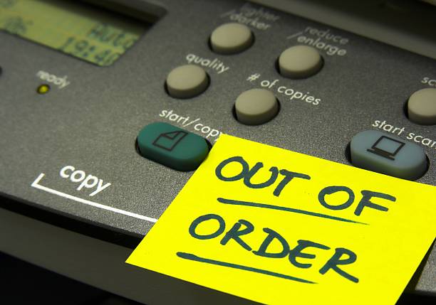 Out of order 2 A copier with a "Out of order" yellow Post-it note on it xerox photocopy machine stock pictures, royalty-free photos & images