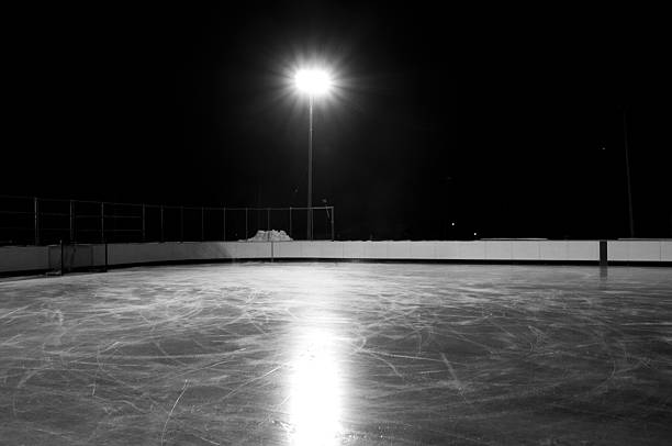 Outdoor hockey rink at night stock photo