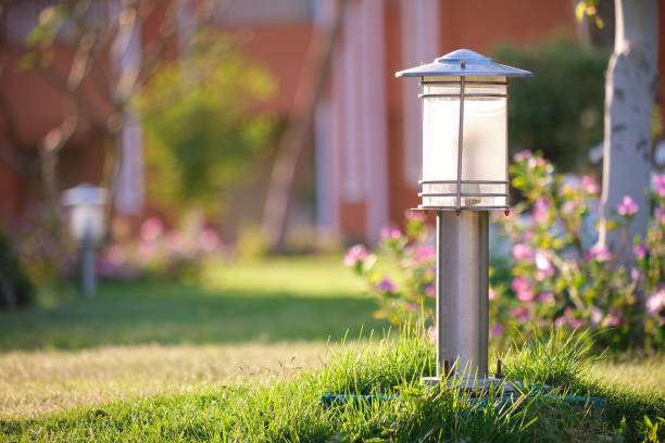 Outdoor lamp on yard lawn for garden lighting in summer park stock photo