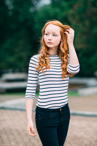 Curly haired redhead outdoors