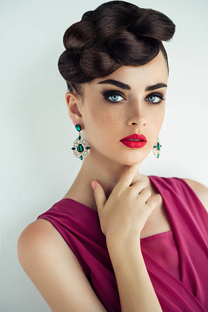 Outdoor shot of young beautiful woman Studio shot of young beautiful woman wearing dress and jewelry haute couture. Professional make-up and hairstyle. high fashion model stock pictures, royalty-free photos & images