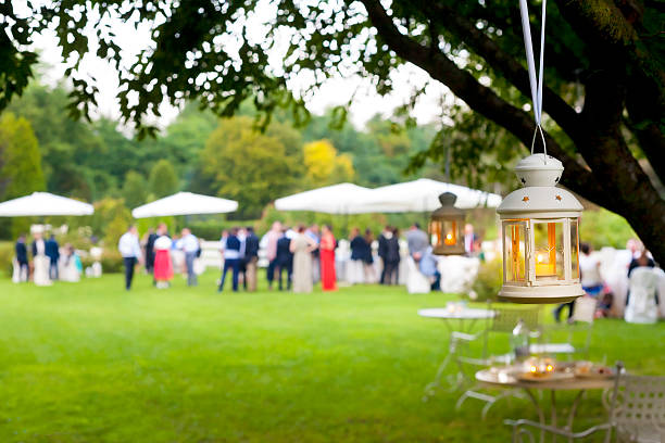 Outdoor wedding reception with green scenery stock photo