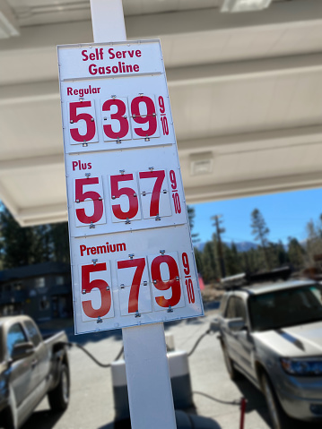 Extremely high gas prices Thanksgiving week in California. $5.39 per gallon for regular. $5.57 for plus. $5.79 for Premium. Gas prices over five dollars in California. Cars at the pump paying for gas over $5 per gallon. Highway robbery in cost of gasoline
