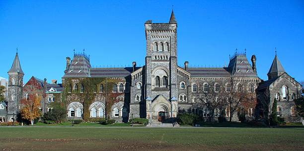 Outside of the University of Toronto in Canada "The main building of University College,  building, built 1853, considered one of North America's finest buildings in the Norman style of architecture.(I work near the University of Toronto, and have many other photos available, including 8mp file sizes.)" university of toronto stock pictures, royalty-free photos & images