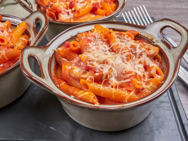 Oven baked penne rigatte (pasta al forno), homemade stock photo