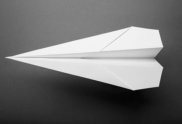 Overhead photo of a paper airplane stock photo
