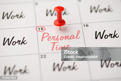 istock Overhead photo of label date 15 with inscriptions personal time and work with red pin isolated on the calendar background 1348657852