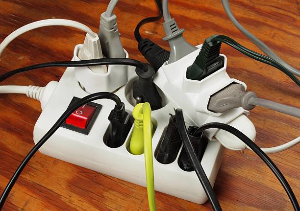 Overloaded extension cord stock photo