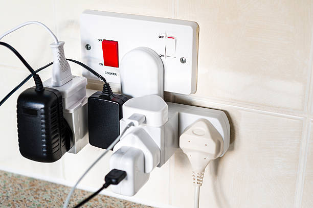 Overloaded kitchen electrical socket stock photo