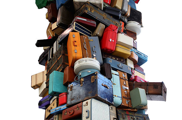 Overpacked - High Stack of Luggage NOTE TO INSPECTOR:  The Artist, Brian Goggin, incorrectly filled out the iStock form, however we had a side agreement where I provided him 100.00 for the license.  Please see both documents that I have attached in one file.  I am hoping this will suffice as it took the artist months to return the incorrect document to me.  I will seek a corrected document if you need it.  Thank you.  Please erase this if approved.  (or I can do it once it's online) medium group of objects stock pictures, royalty-free photos & images