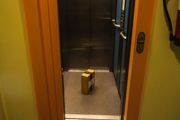 package in the elevator stock photo