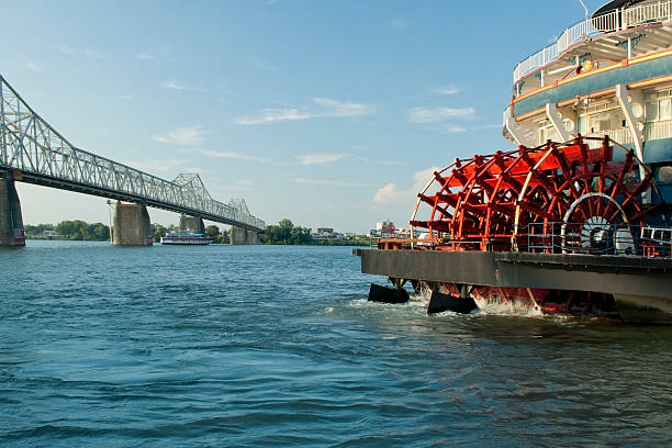 Paddlewheel "Photo of a paddleboat, with a metalic bridge on backgroundPlease see some similar pictures from my portfolio:" cincinnati stock pictures, royalty-free photos & images