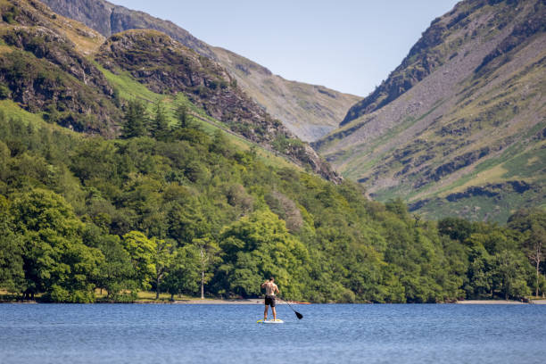 Paddling in Buttermere, Lake District stock photo