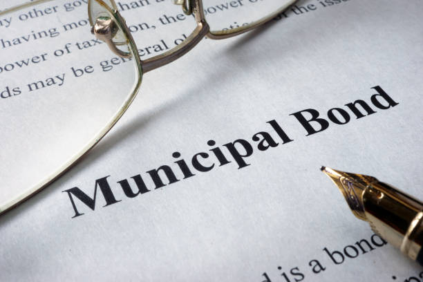 Page of newspaper with words municipal bonds. Page of newspaper with words municipal bonds. Trading concept. bond market  stock pictures, royalty-free photos & images