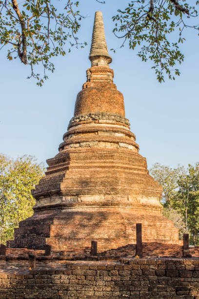 pagoda or chedi on the ruins of ancient Buddhist temple stock photo