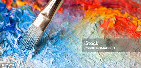 istock Paintbrush with oil paint on a classical palette 157740918