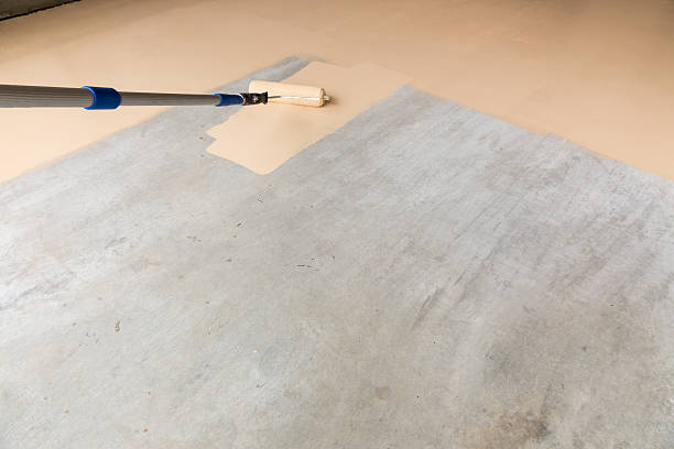 Painting Floor of Garage stock photo