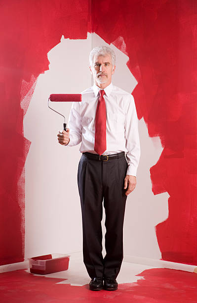Painting Himself Into A Corner stock photo