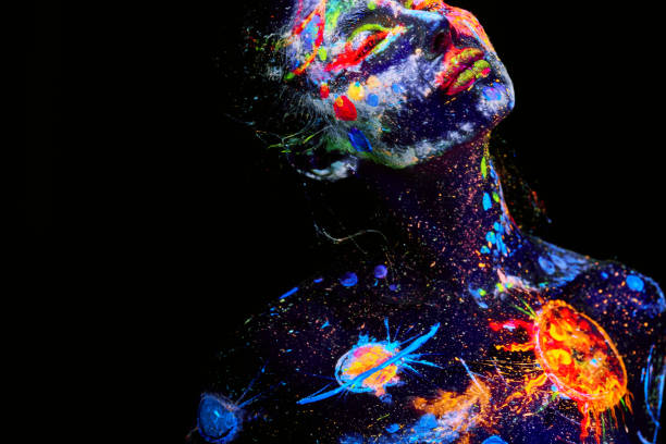 UV painting of a universe on a female body portrait stock photo