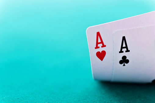 Pair of aces on table.