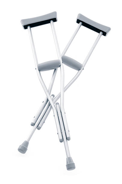 Pair of crutches against white background stock photo