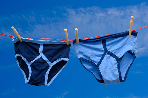 pair of retro male underpants on a washing line Two pairs of retro male underpants drying on a washing line underwear male stock pictures, royalty-free photos & images
