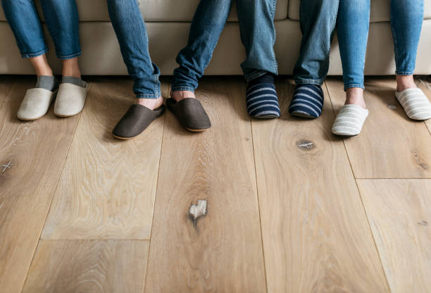 Pairs of legs with wooden floor Pairs of legs with wooden floor roommate stock pictures, royalty-free photos & images