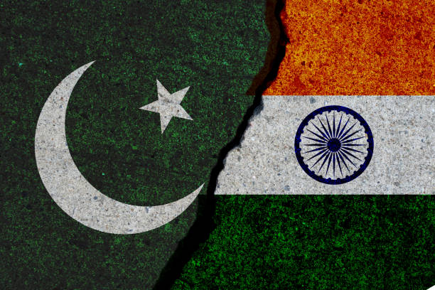 pakistan and india flags painted over cracked concrete wall stock photo