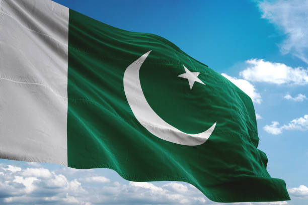 Pakistan flag waving cloudy sky background Pakistan flag waving cloudy sky background realistic 3d illustration pakistani flag stock pictures, royalty-free photos & images