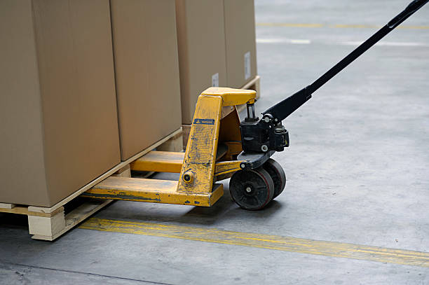 pallet truck with carton boxes stock photo
