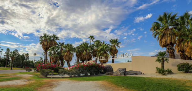 Palm Springs welcome sign on the edge of town Panoramic view of the Palm Springs Welcome sign near the visitors center palm springs california stock pictures, royalty-free photos & images