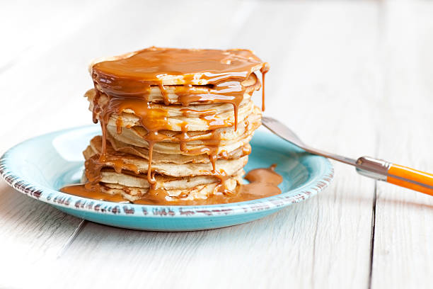 Pancakes with caramel sauce stock photo