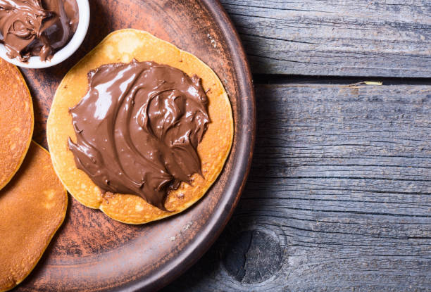 Pancakes with chocolate spread stock photo