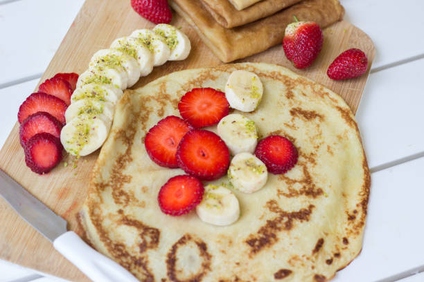 Pancakes with fruits stock photo