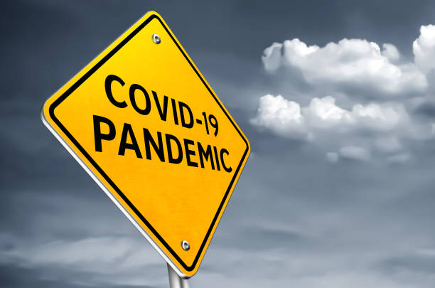 COVID 19 pandemic - roadsign message stock photo